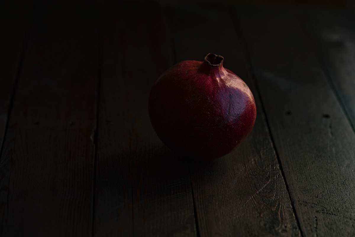 food red pomegranate fruit on brown wooden surface apple