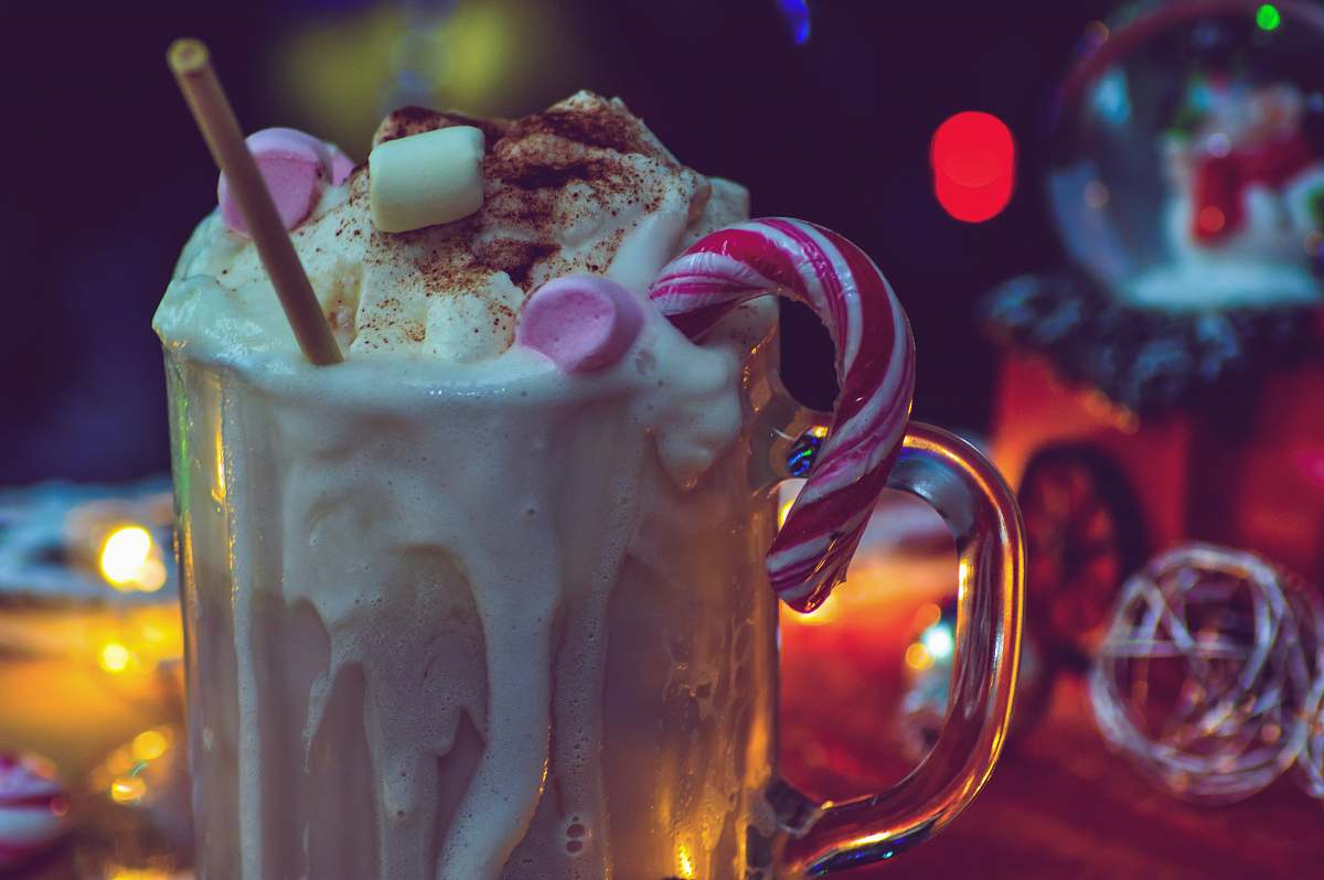 juice glass of ice cream with variety of toppings milk