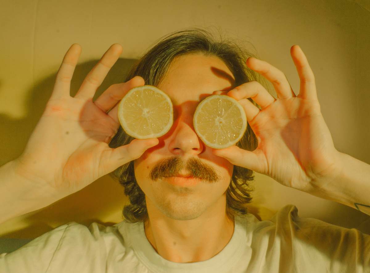 fruit person holding lemon citrus fruit