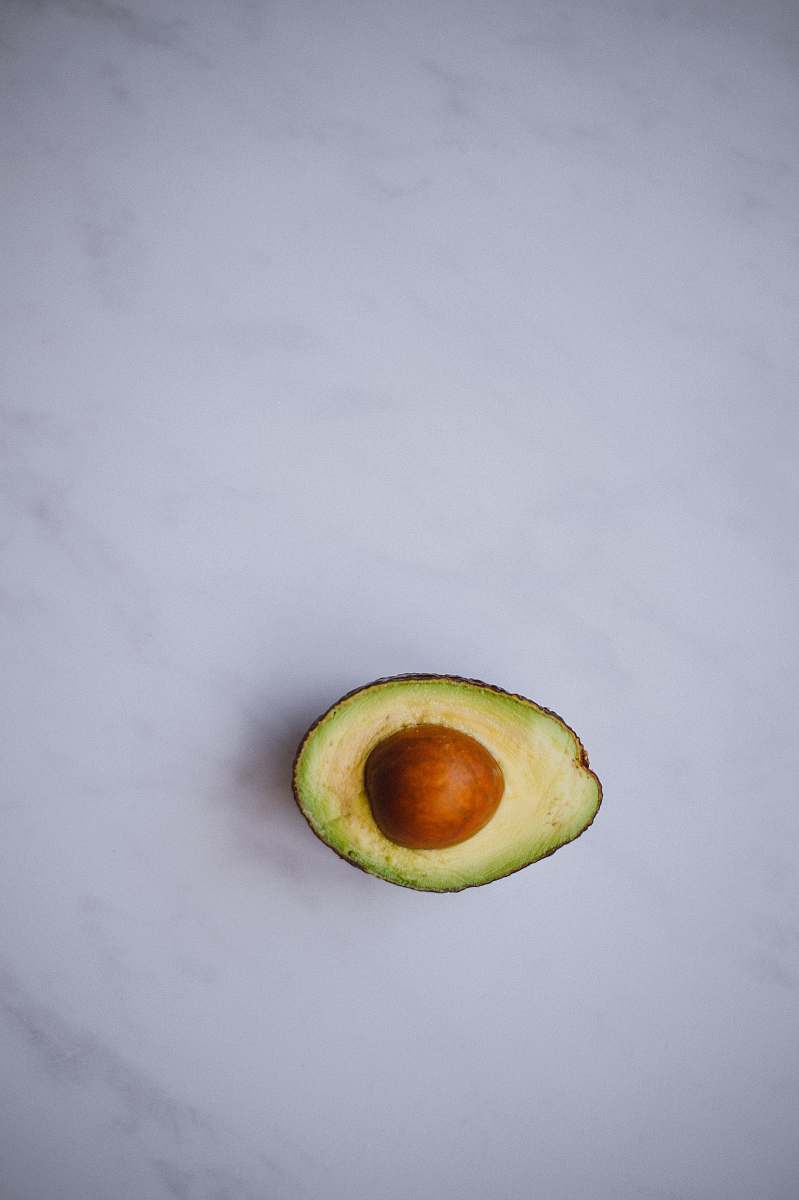 food photo of avocado on white surface avocado
