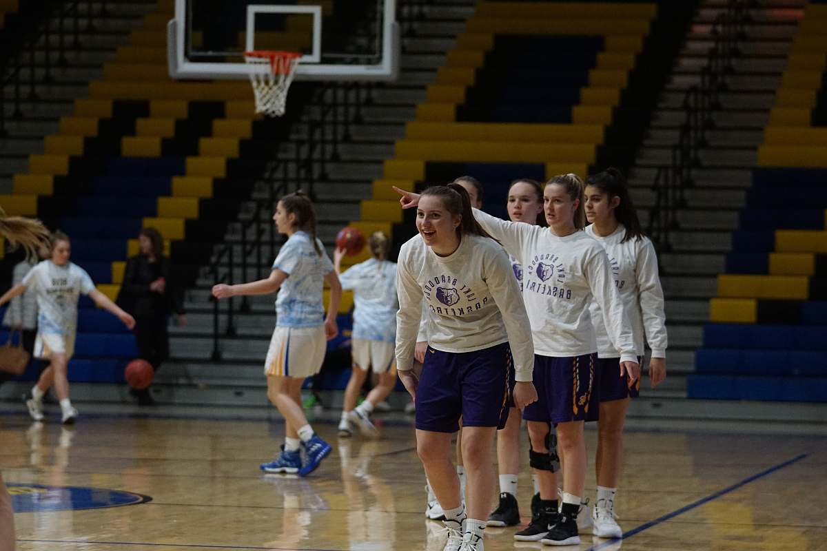 clothing group of girls playing basketball inside court shorts