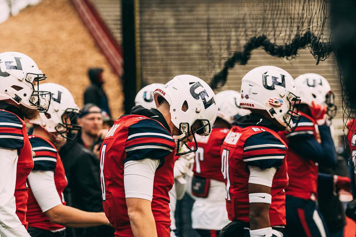clothing group of men playing football helmet