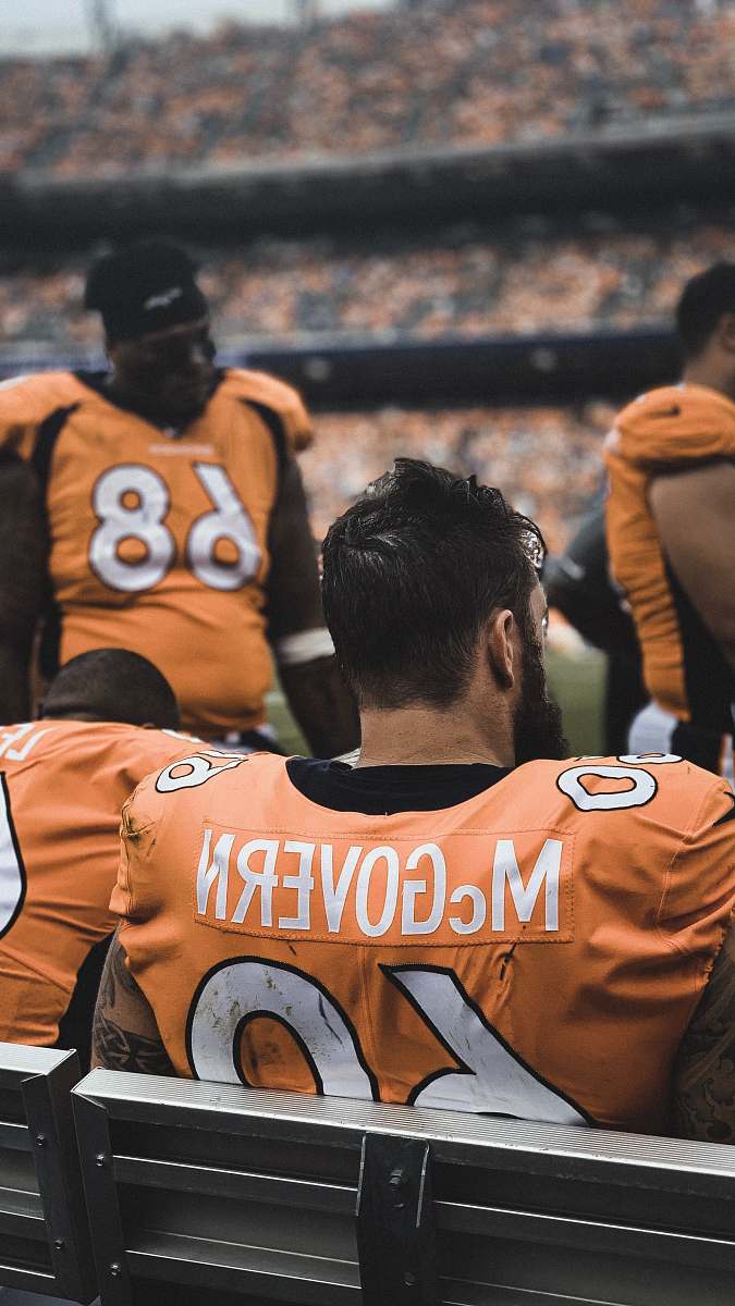 clothing man in orange jersey shirt football