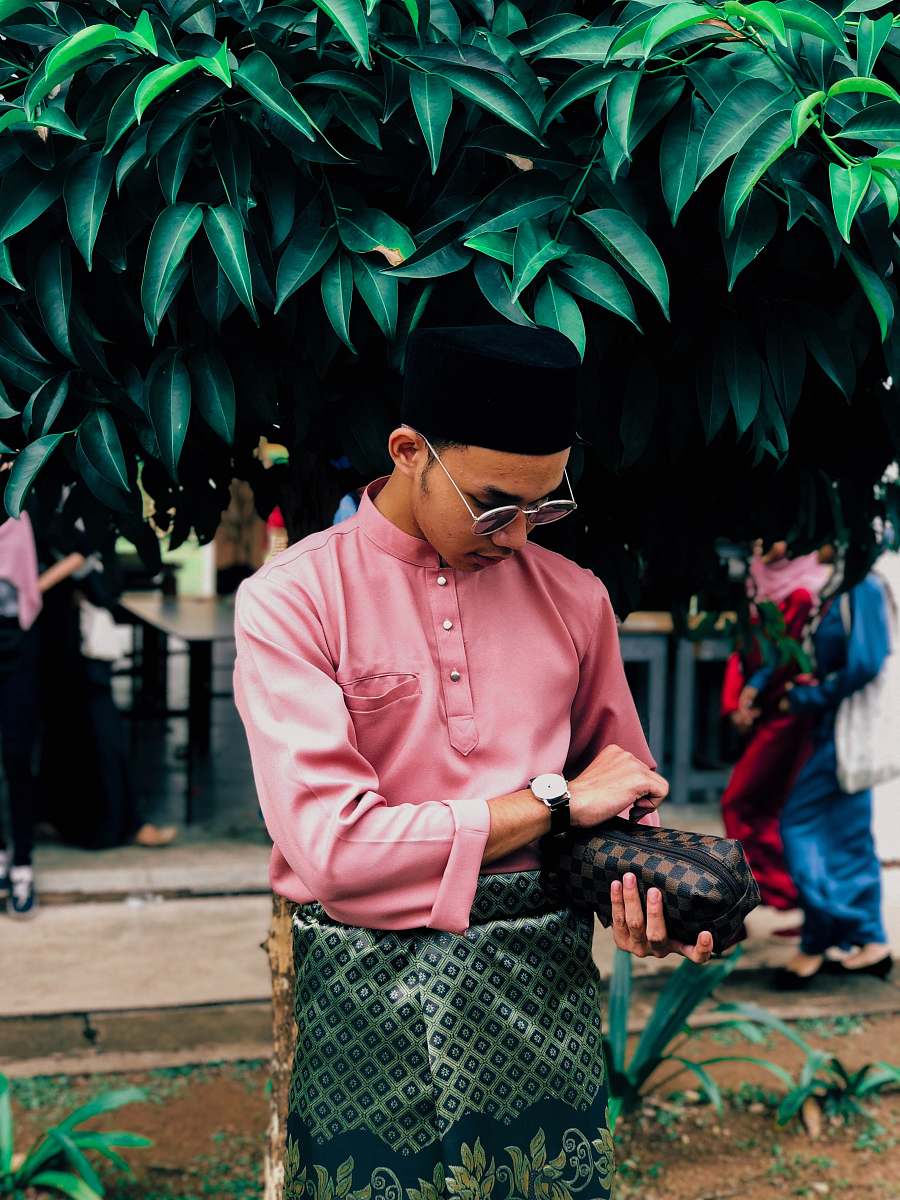 clothing man wears pink long-sleeved shirt human