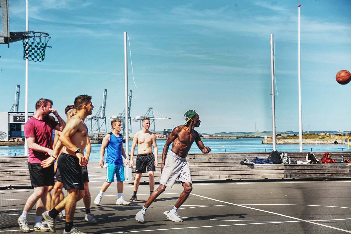 clothing men playing basketball during daytime shorts