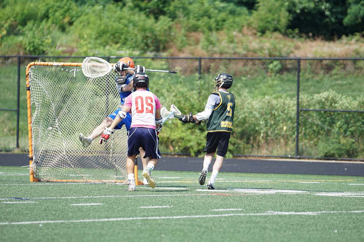 human men playing lacrosse person