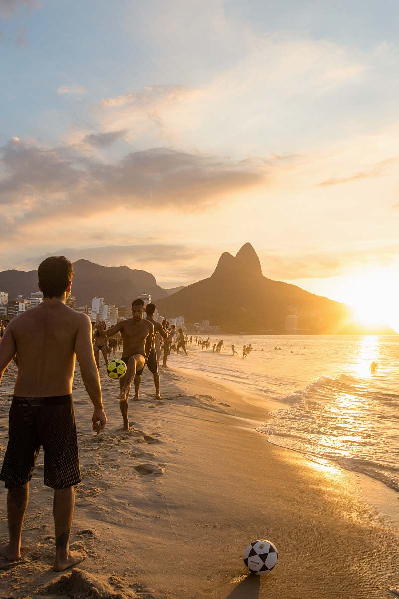 clothing people at the beach during golden hour shorts