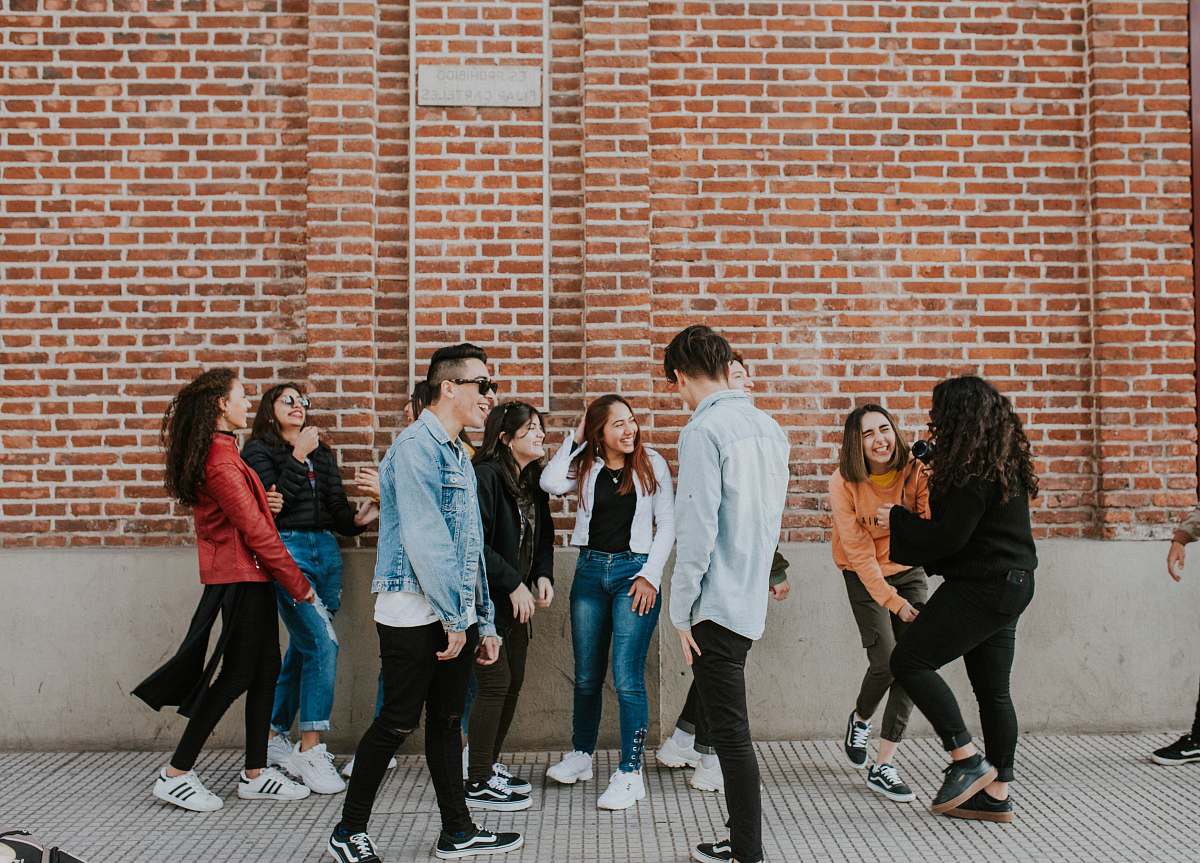 clothing people standing near building shoe