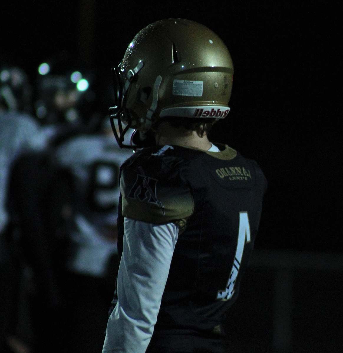 clothing person wearing football gear helmet