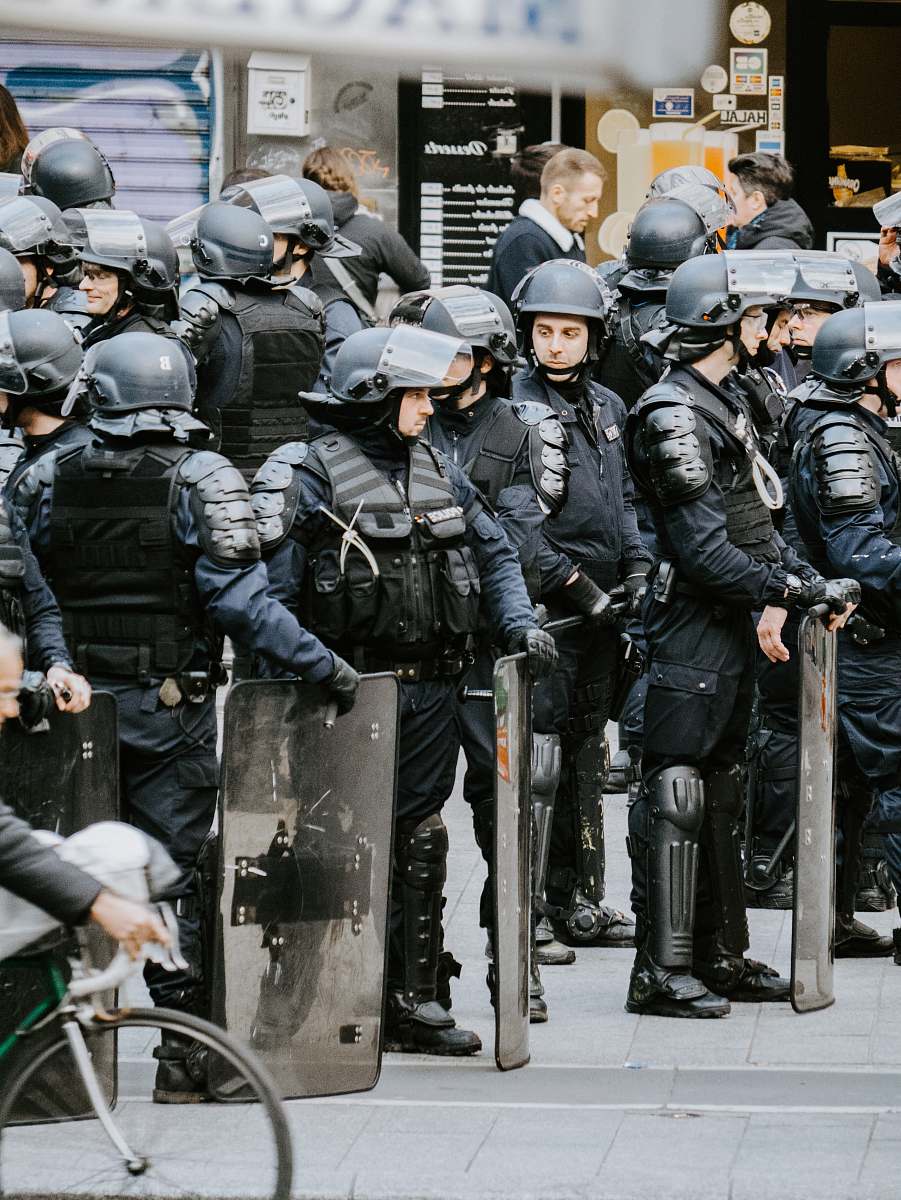 clothing police men wearing helmets helmet