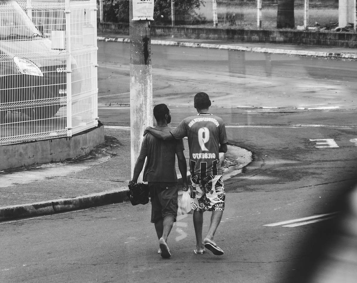 black-and-white two men walking on street clothing