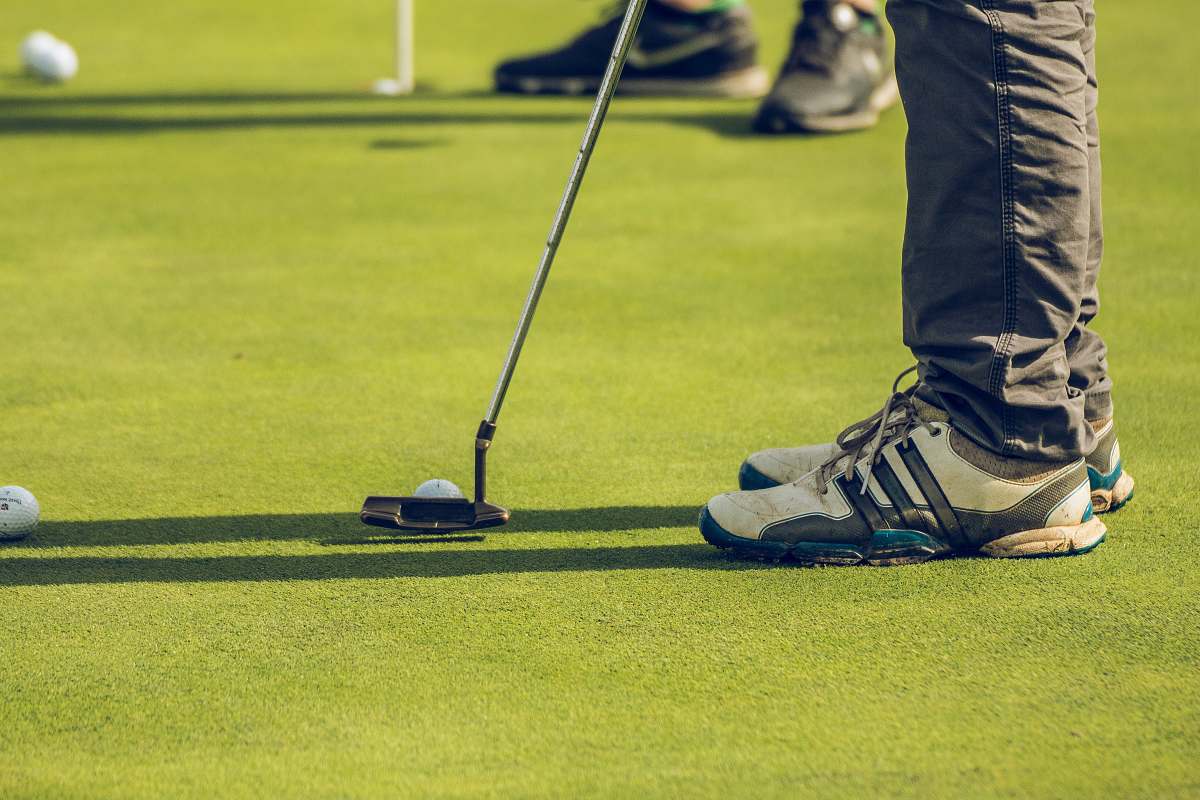 clothing two person playing golf footwear