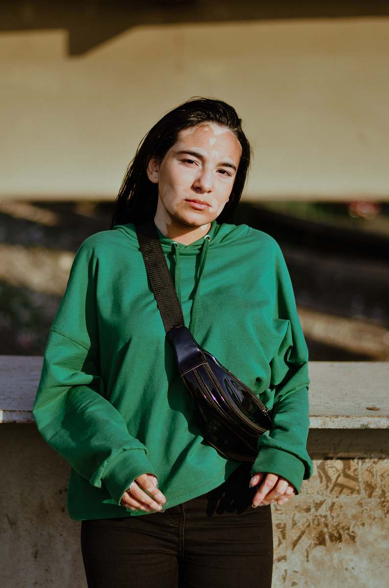 clothing woman wearing green sweatshirt sleeve