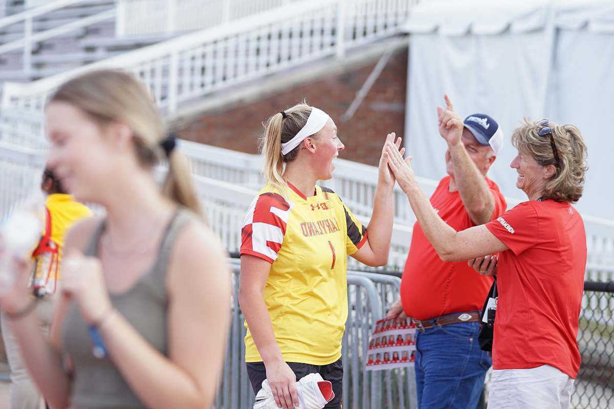 clothing women clapping by man during daytime shorts