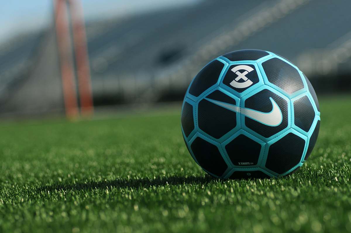 sphere black, blue, and white Soccer ball on grass field soccer