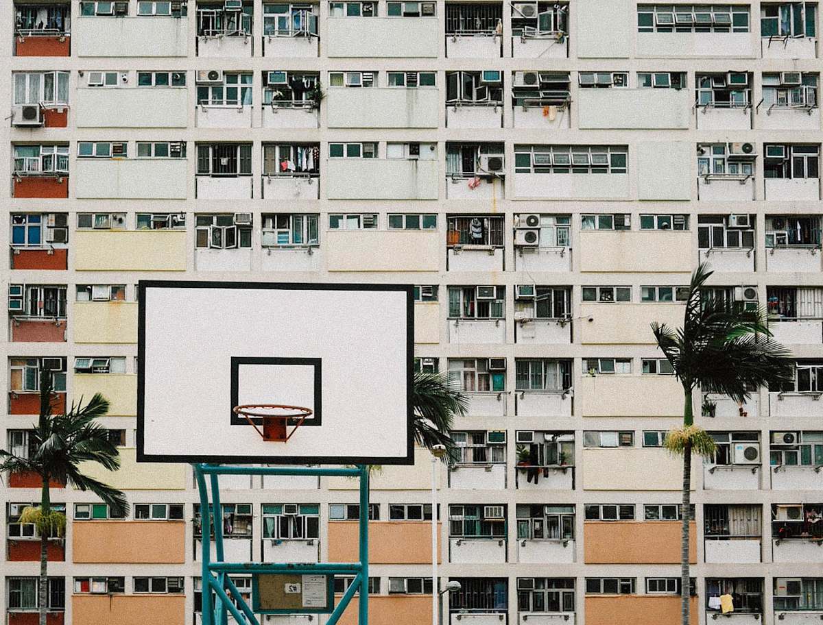 city photo of white and black basketball hoops high rise