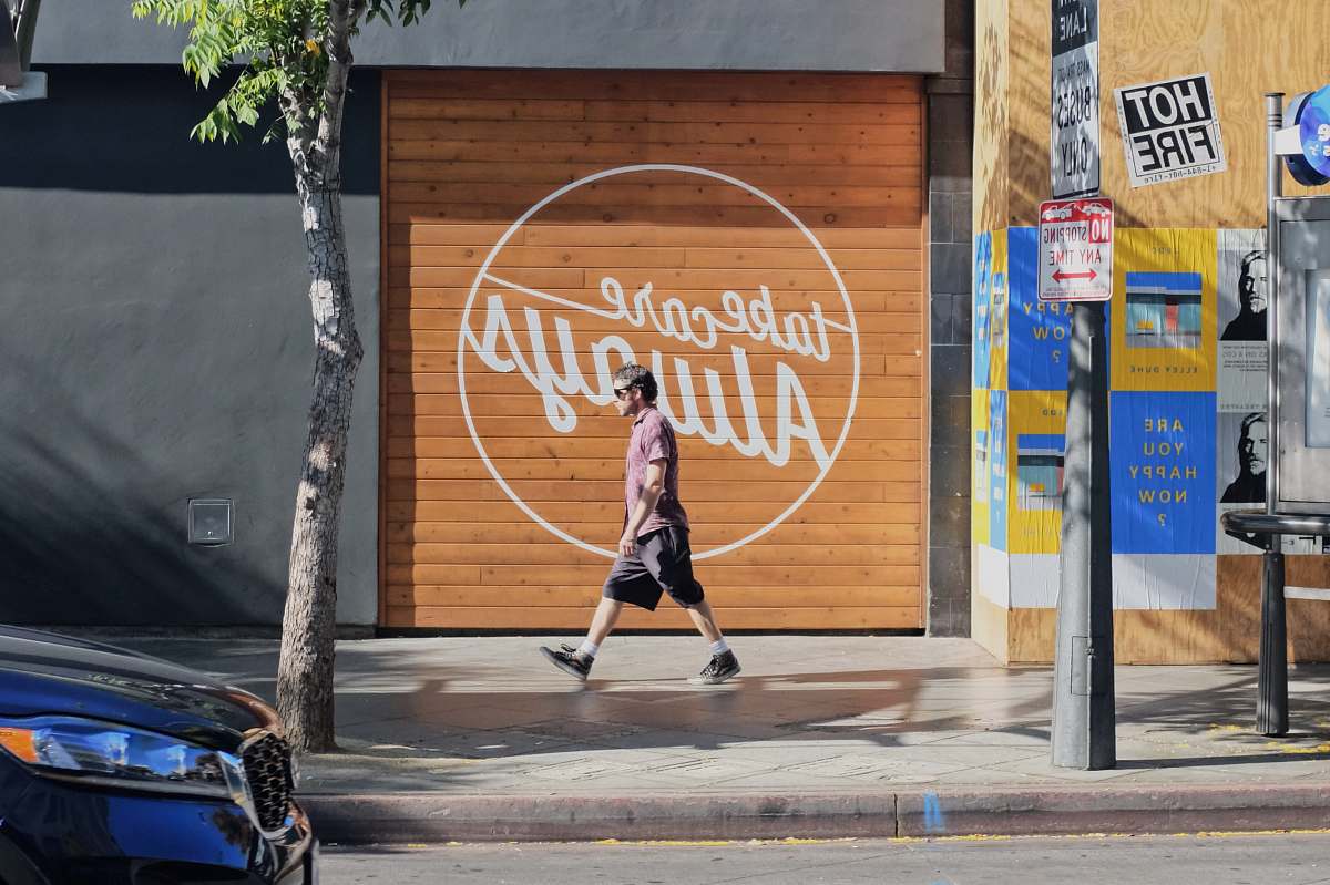 human man walking beside take care always shutter door person
