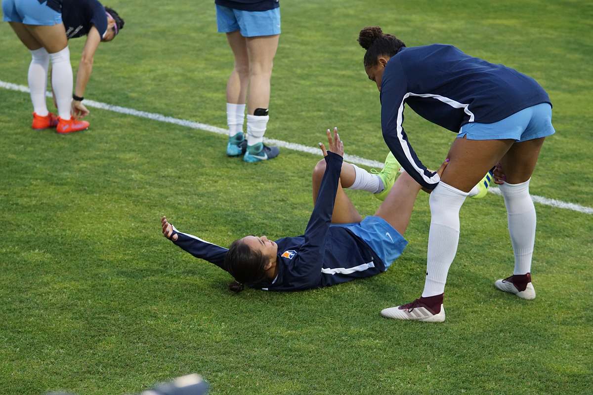 human woman lying on floor by other women person