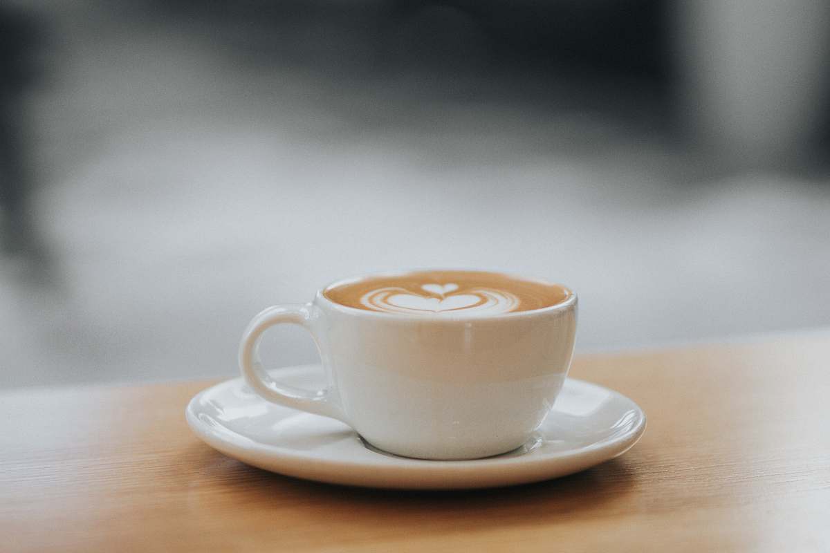 cup white ceramic teacup filled with coffee latte with saucer on the table photography coffee cup
