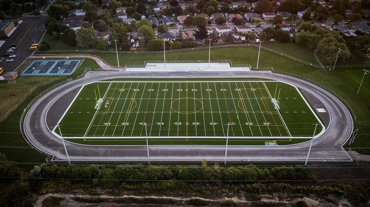 people aerial photo of field building
