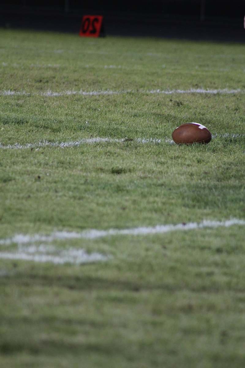 building brown football on field grey