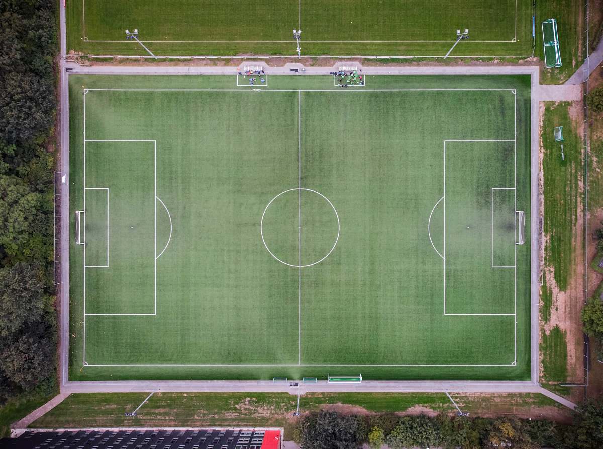 grey empty football field in aerial photgraphy arena