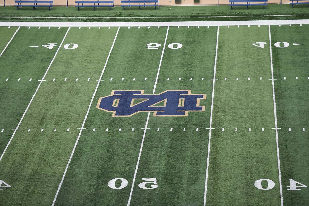 building empty football field with ND logo arena