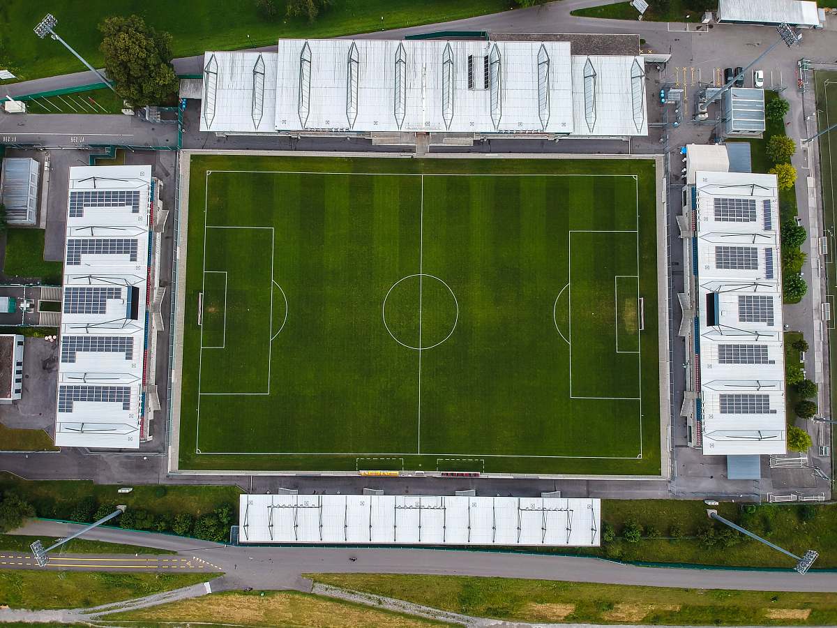 green soccer field building