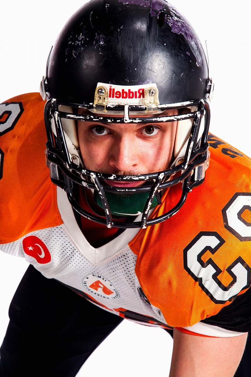apparel man wears black Riddell helmet close-up photography clothing