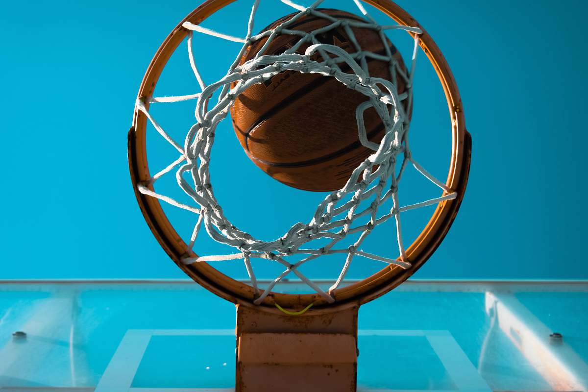sport brown basketball near basketball ring sports