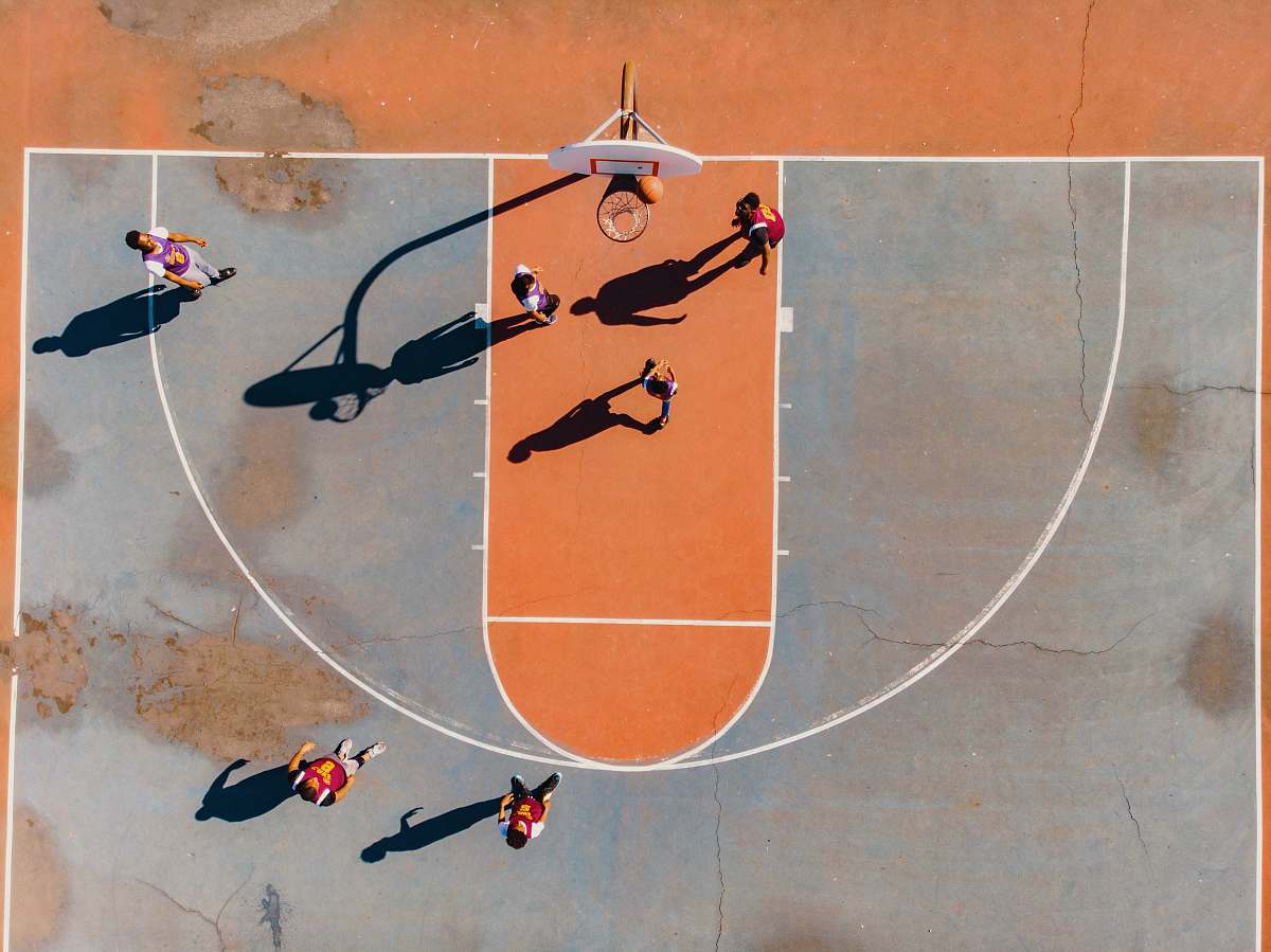 person aerial photography of men playing basketball people