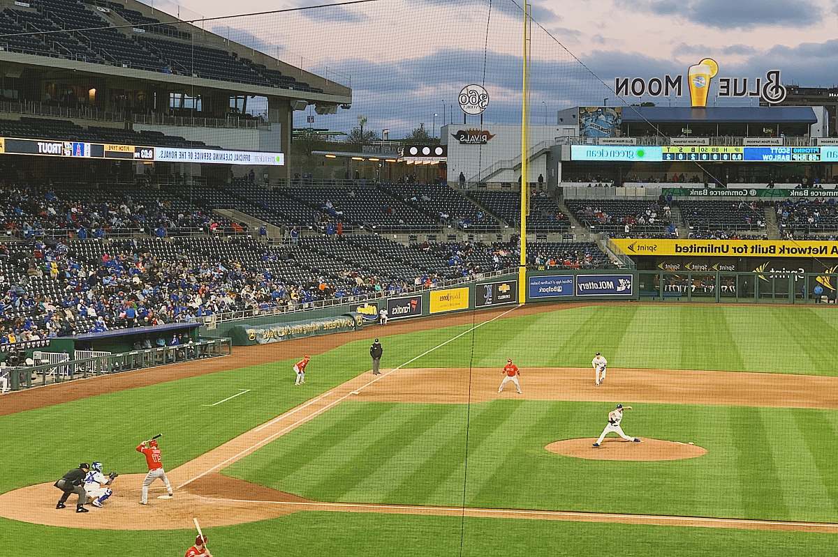person baseball game during day building