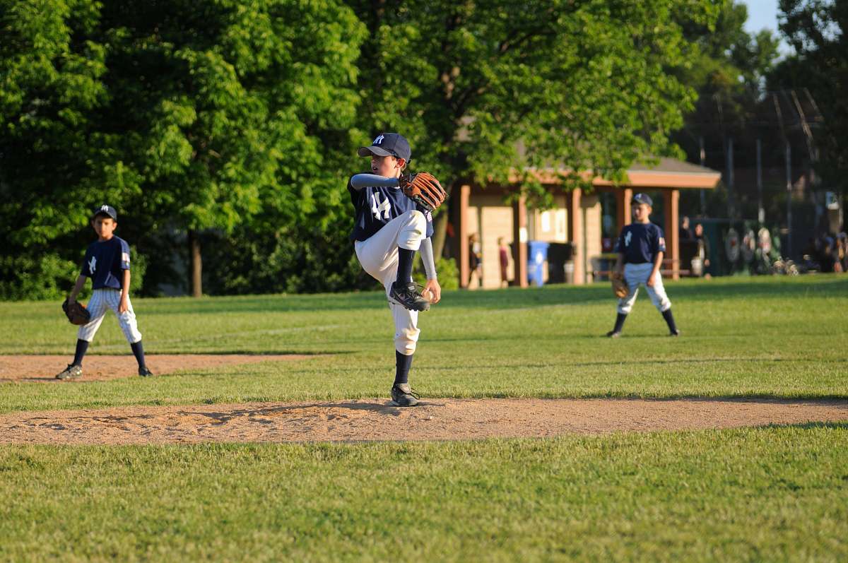 person baseball pitcher on field people