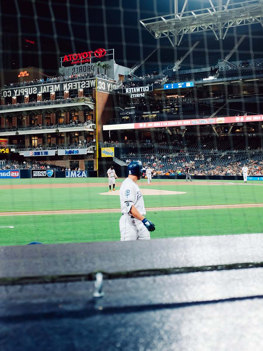 person baseball player standing on field sport