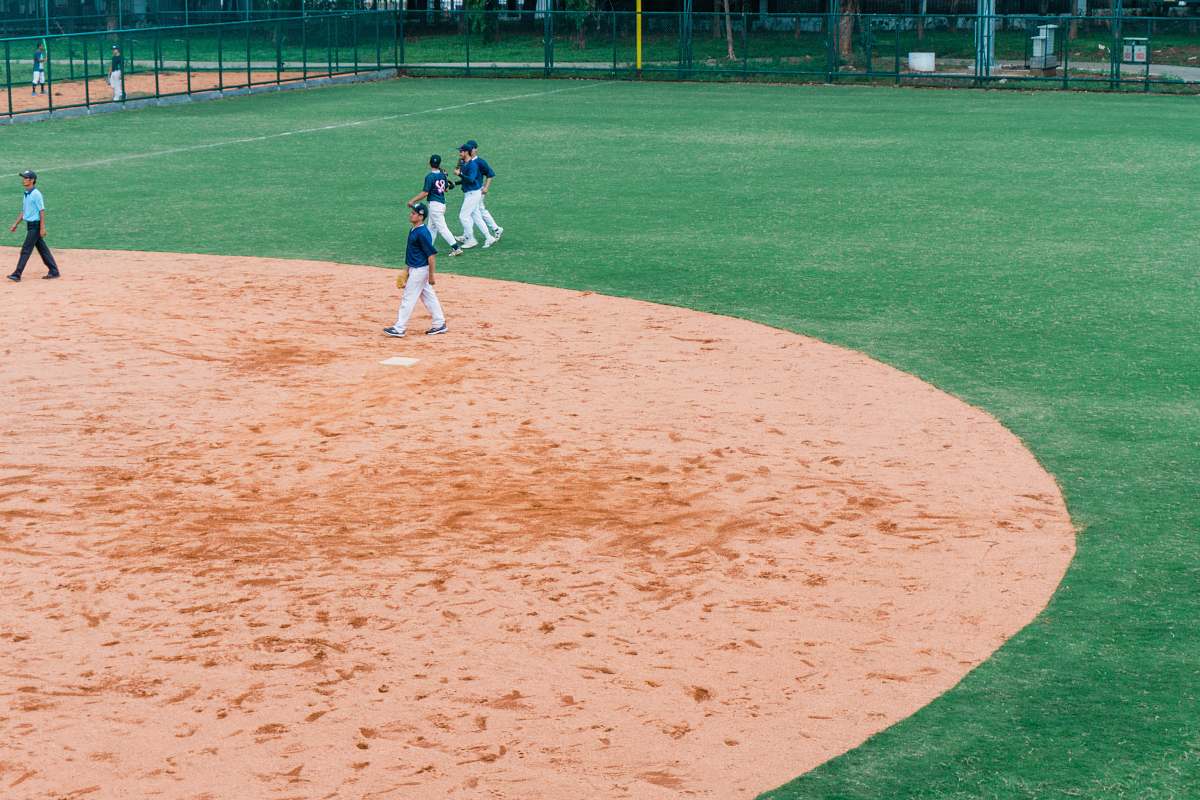 person baseball players on field building