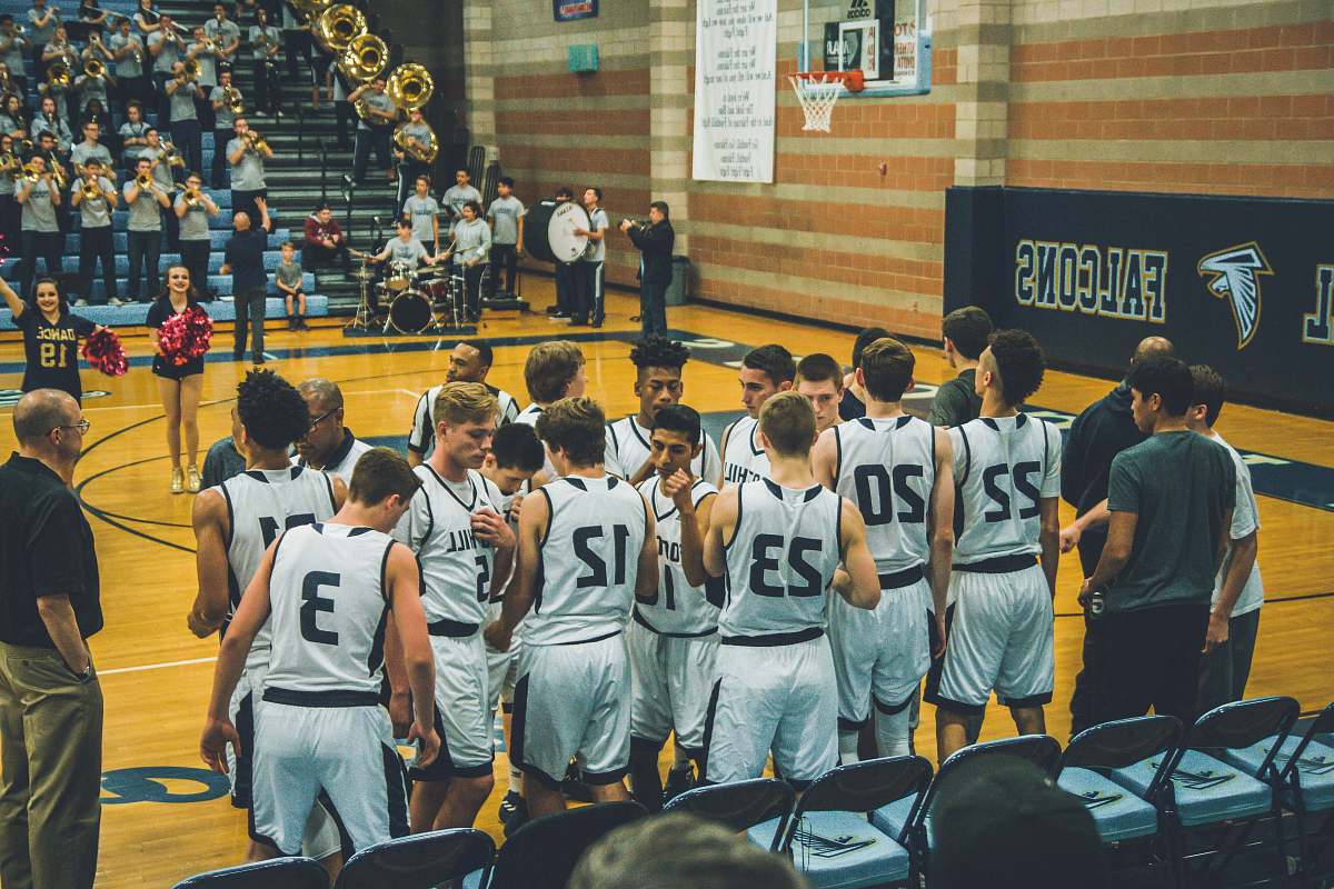 team basketball team standing on courtside person