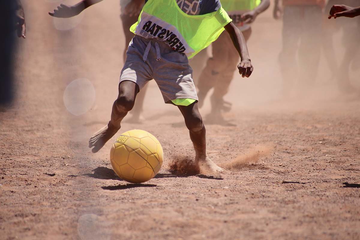 person child playing soccer sphere