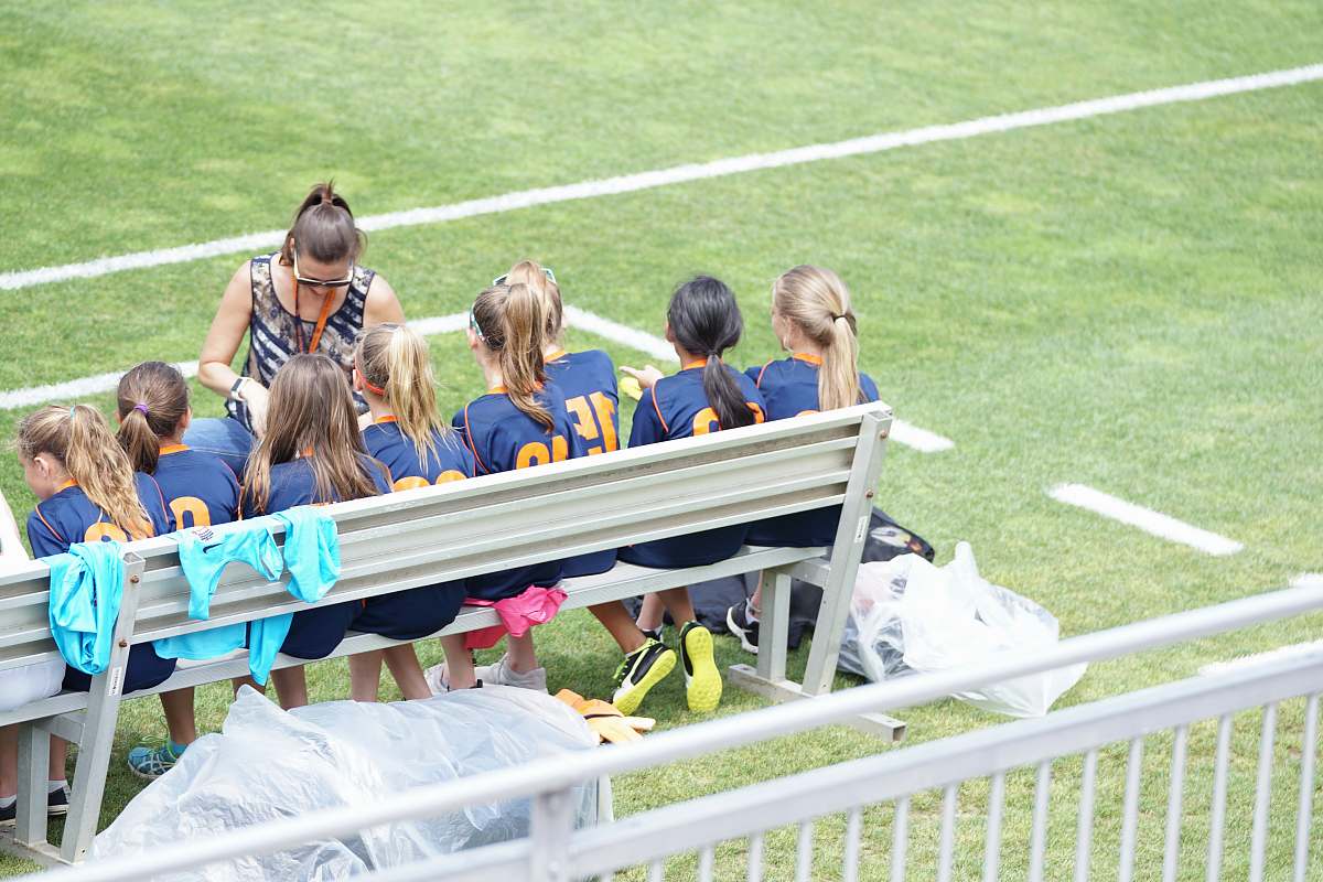 person eight girls sitting on gray bench people