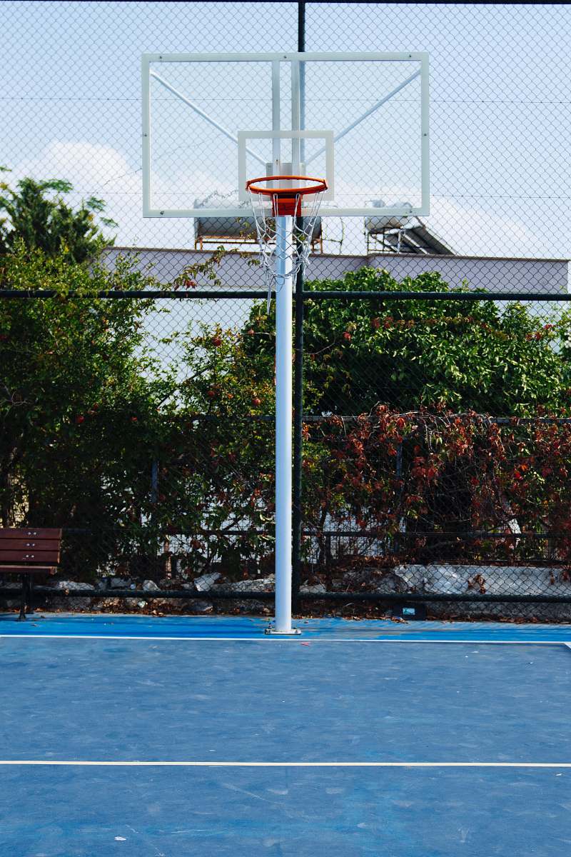 person empty basketball court during daytime people