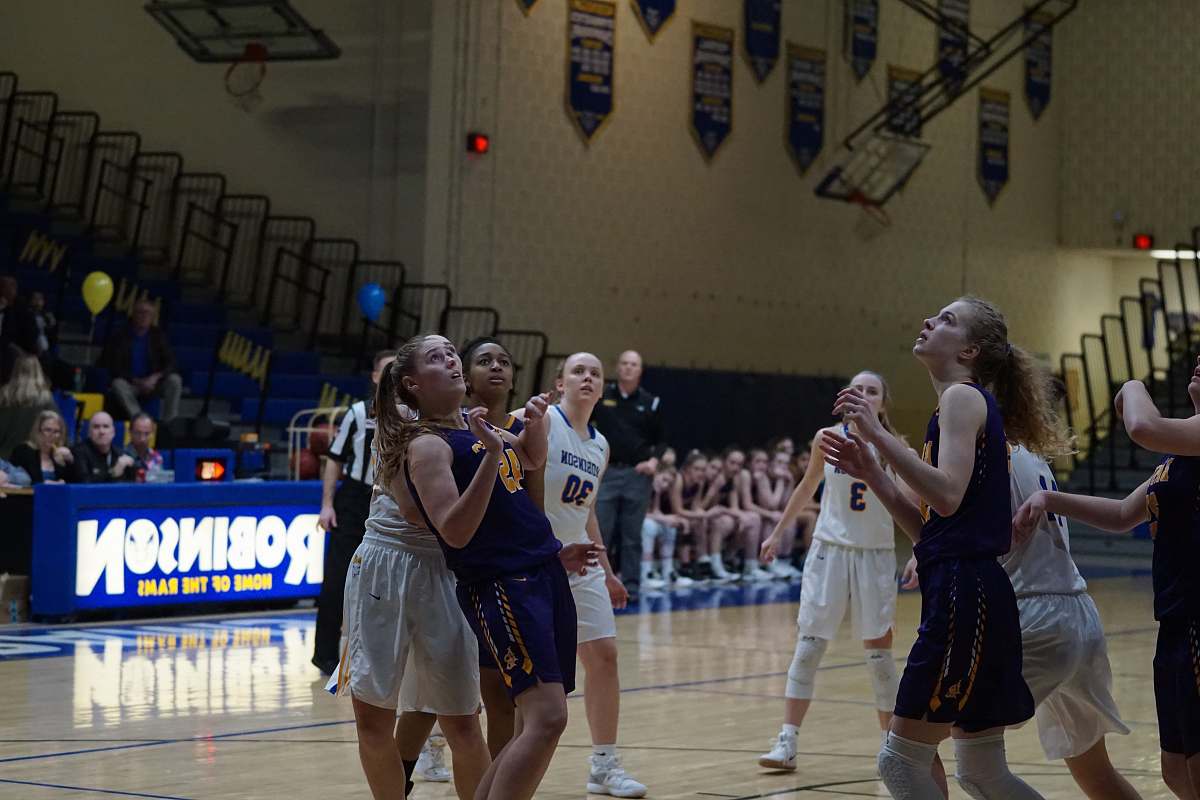 person female basketball players playing on robinson court apparel