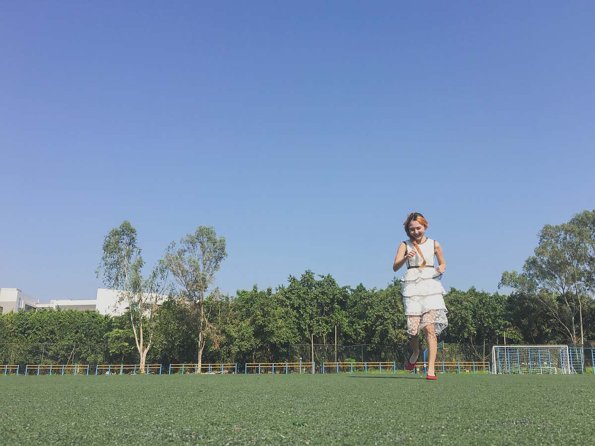 grass girl running in lawn during daytime plant