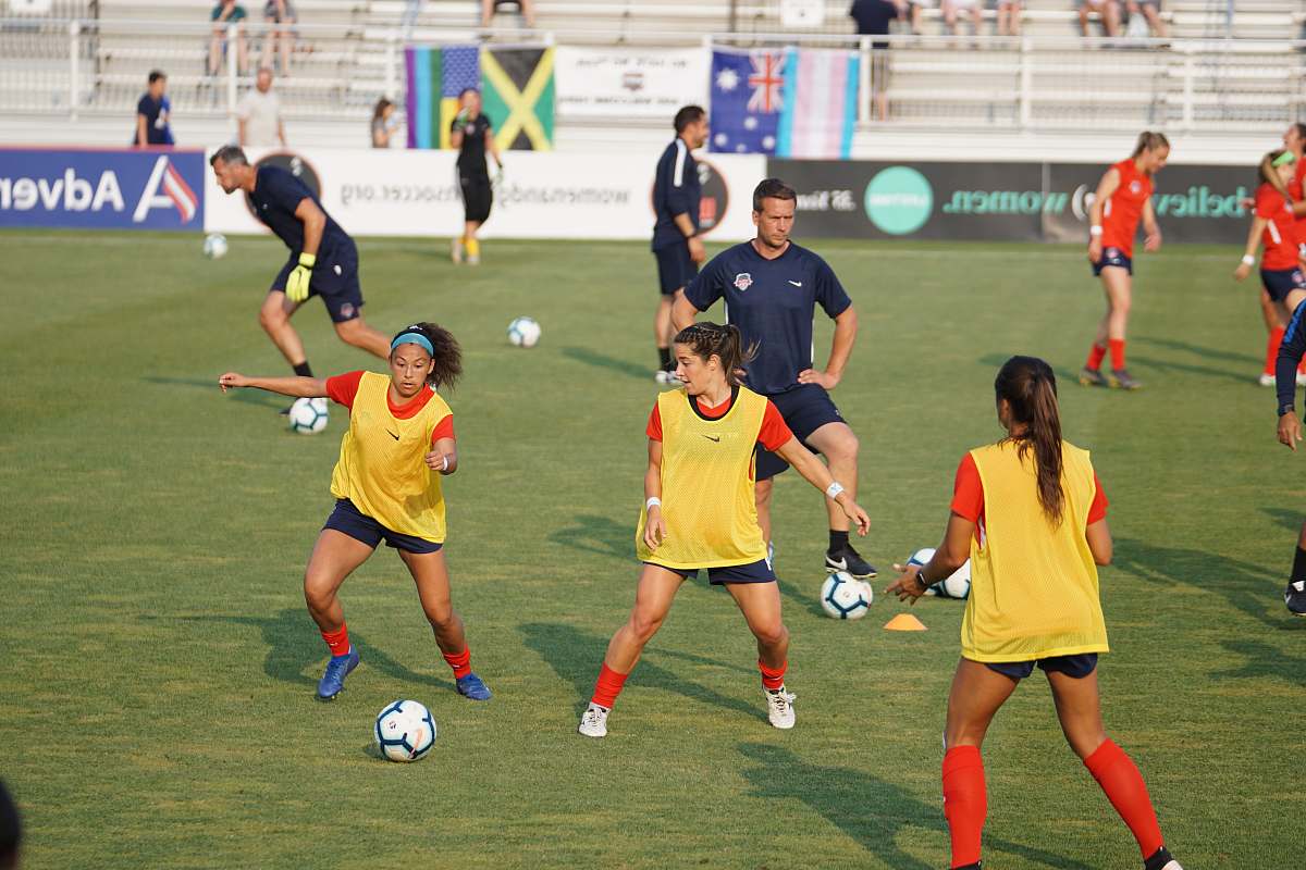 person group of girls playing soccer at daytime people