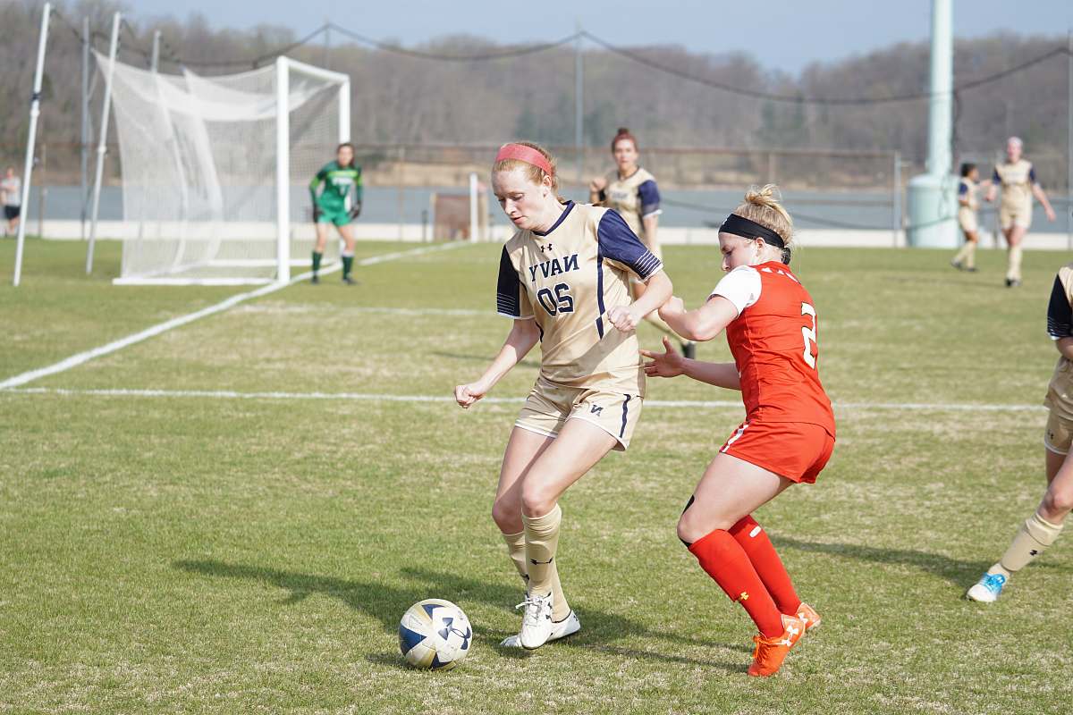 person group of girls playing soccer during daytime people
