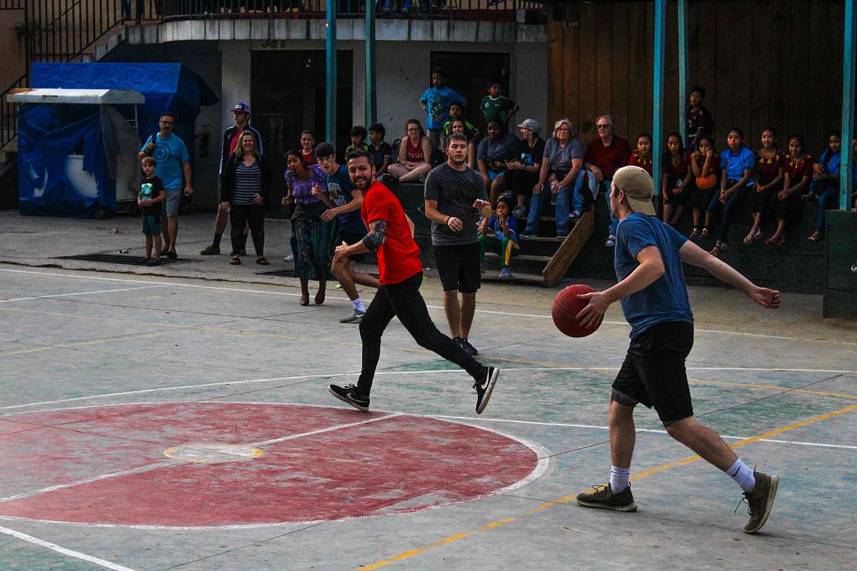 person group of men playing basketball apparel
