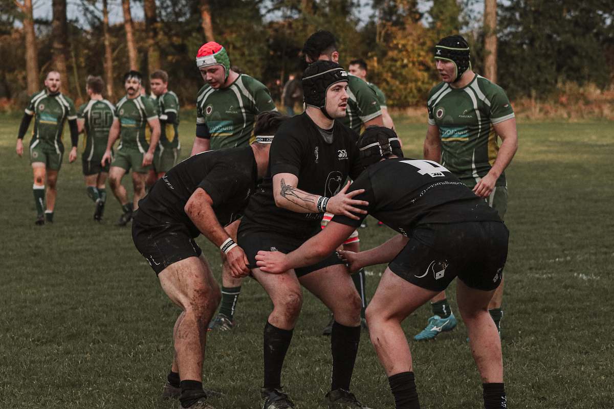 person group of men playing soccer game people