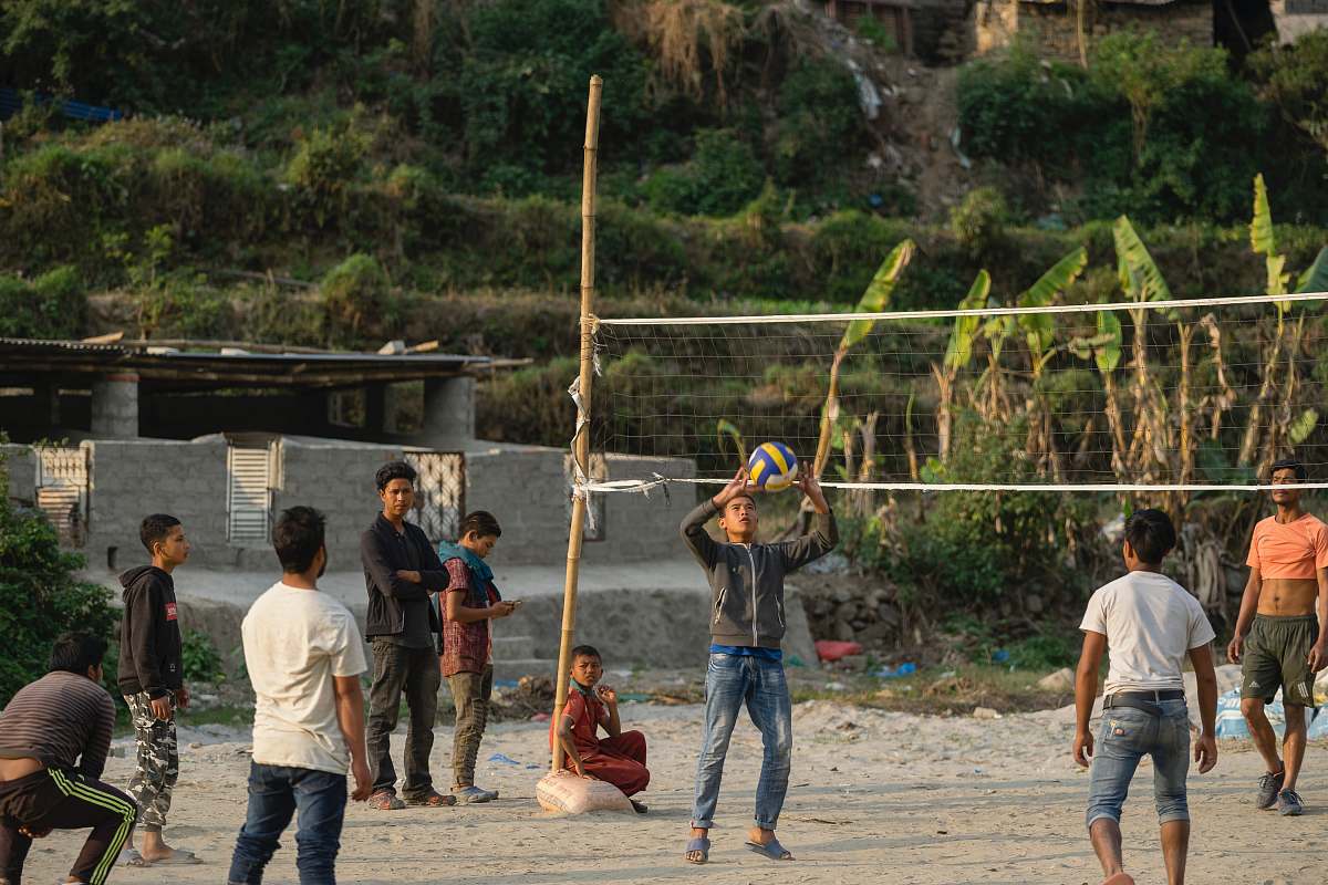 person group of men playing volleyball apparel