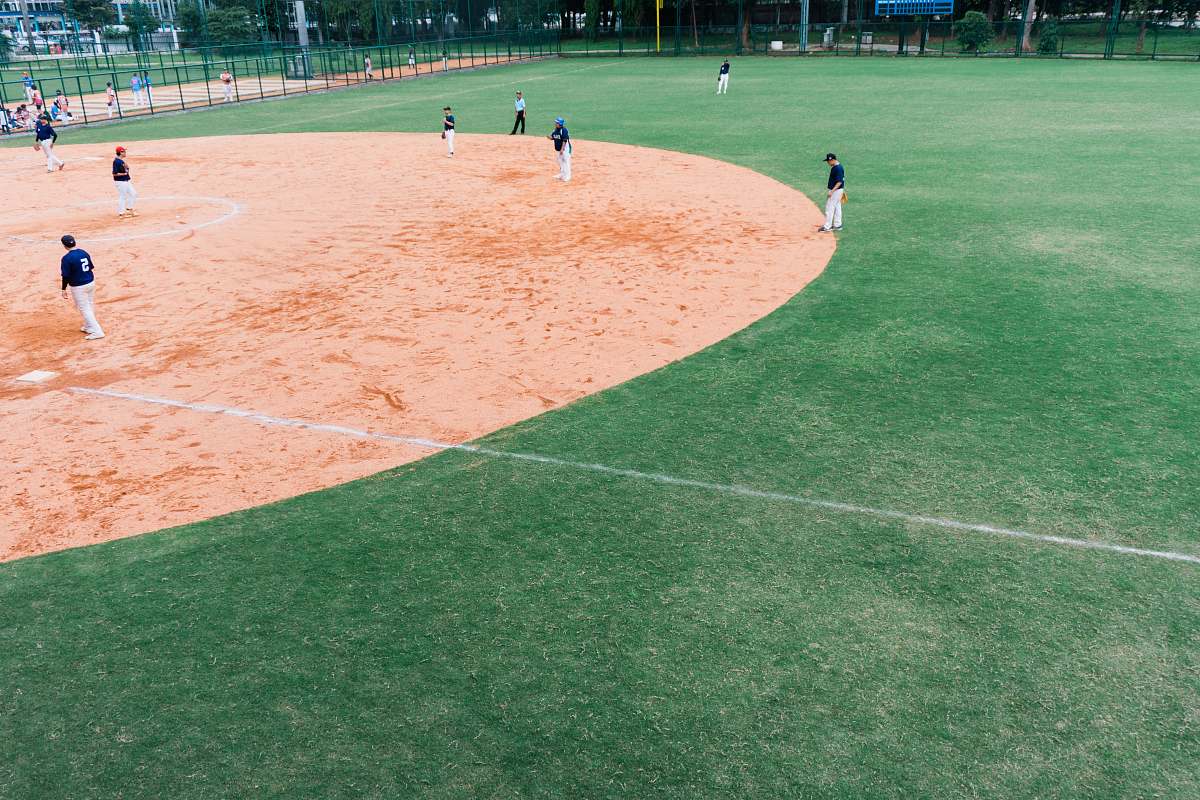 person group of people playing baseball building