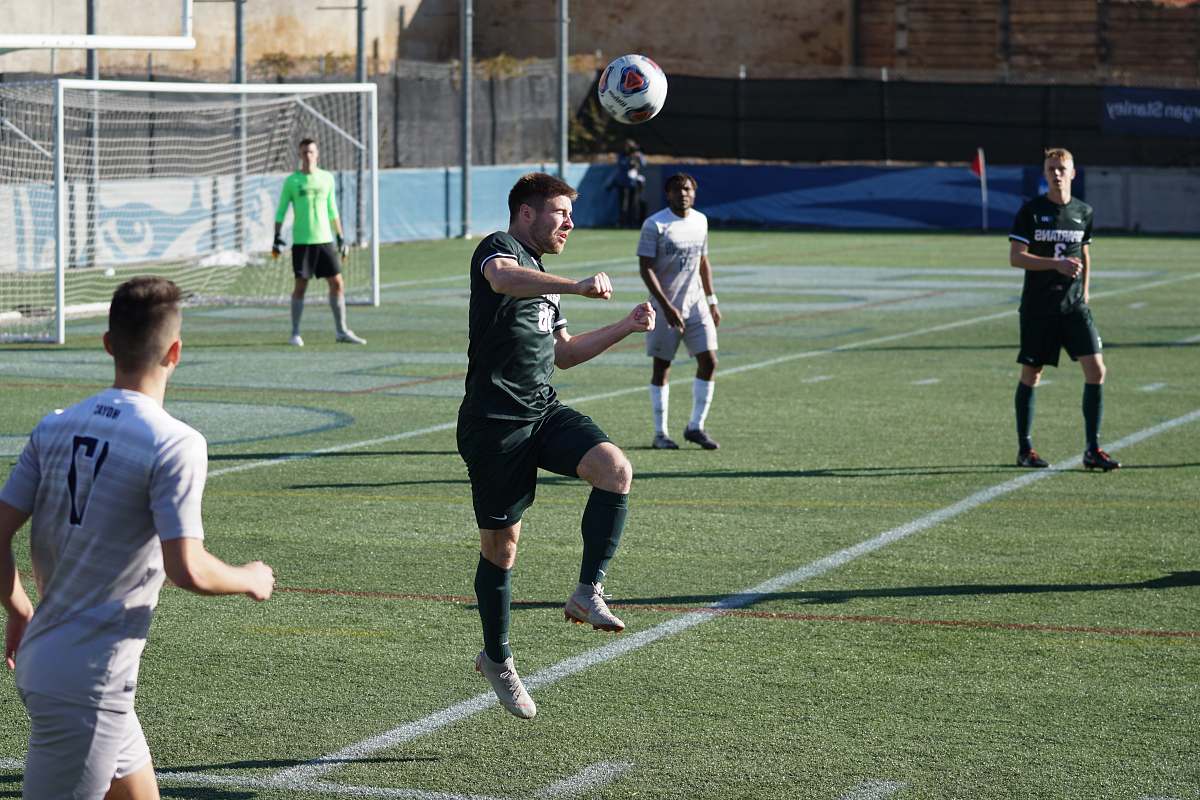 person group of people playing soccer during daytime people