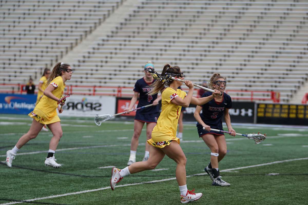 apparel group of women playing lacrosse sport person