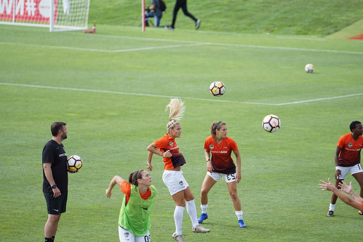 person group of women playing soccer people